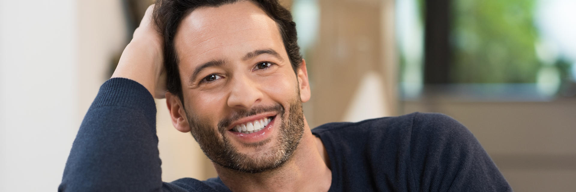 A happy middle-aged man showing nice teeth in his smile.