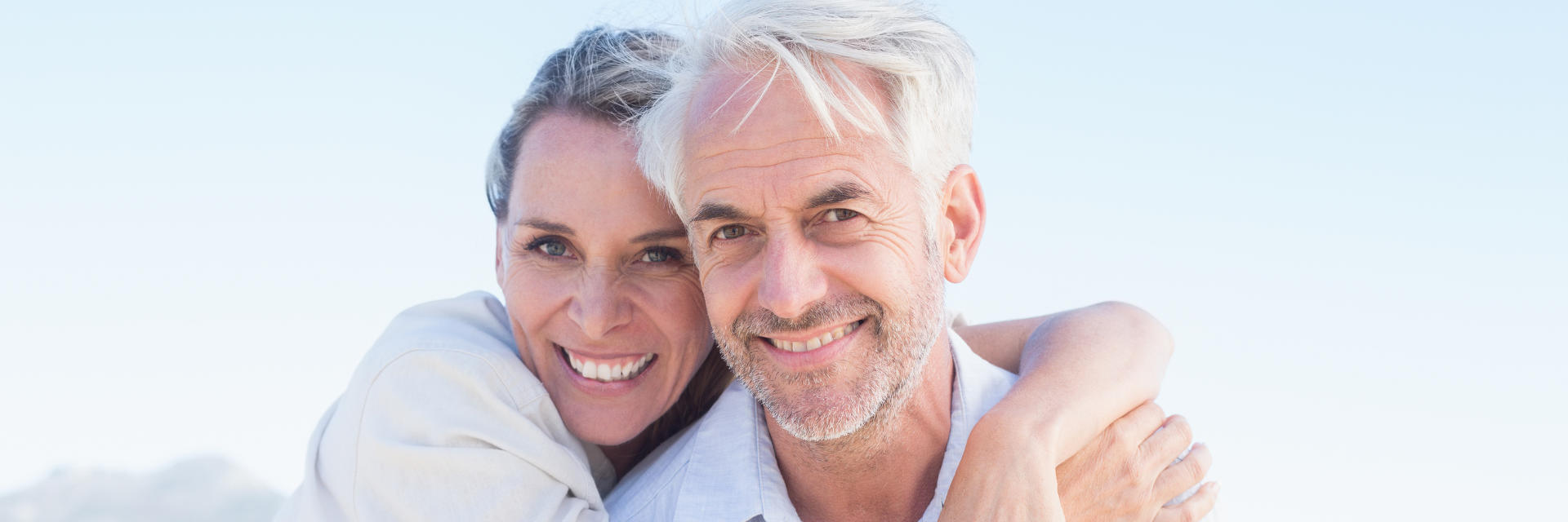 Middle-aged couple with perfect smiles